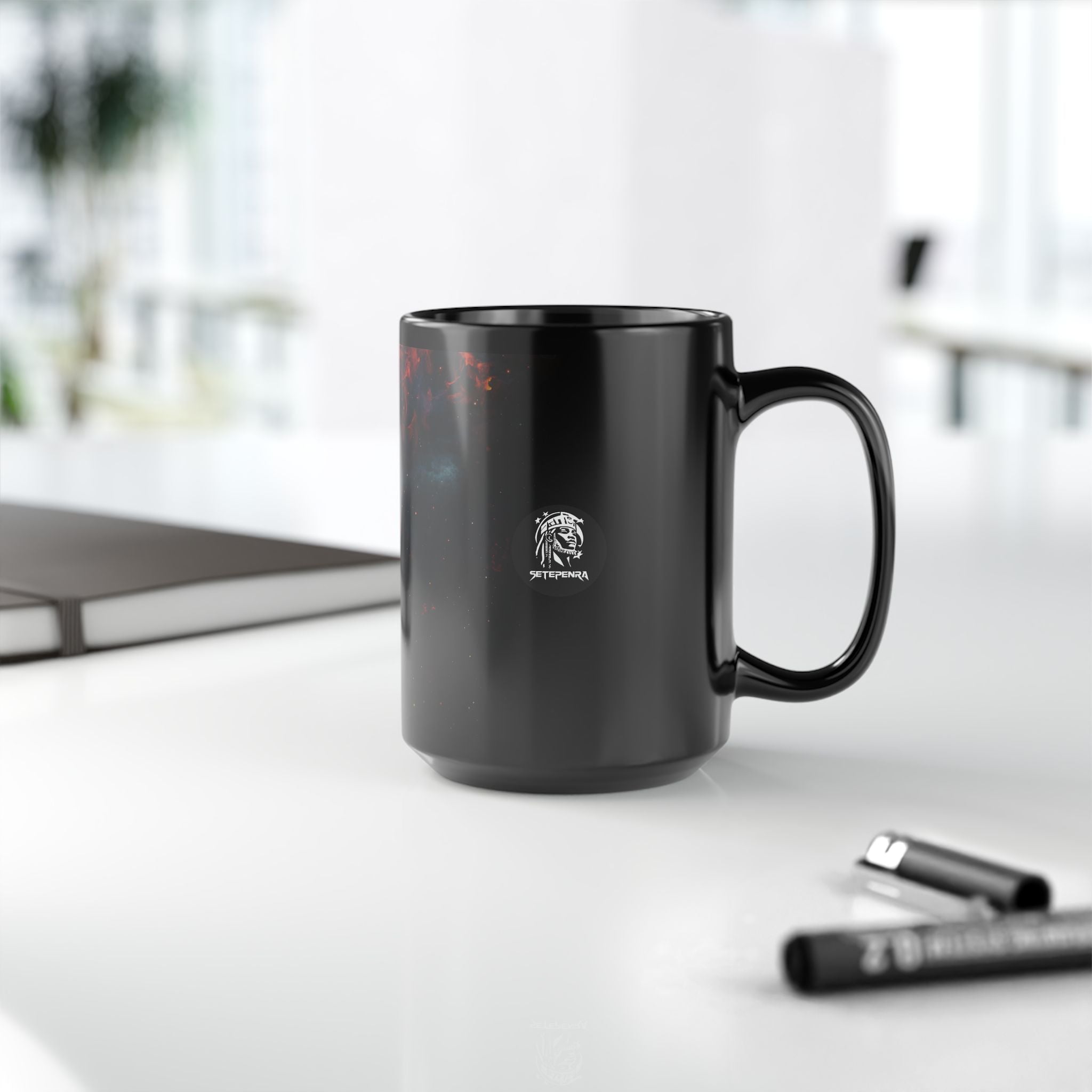 Black ceramic mug featuring the Cosmic Queen design for stylish beverage enjoyment.