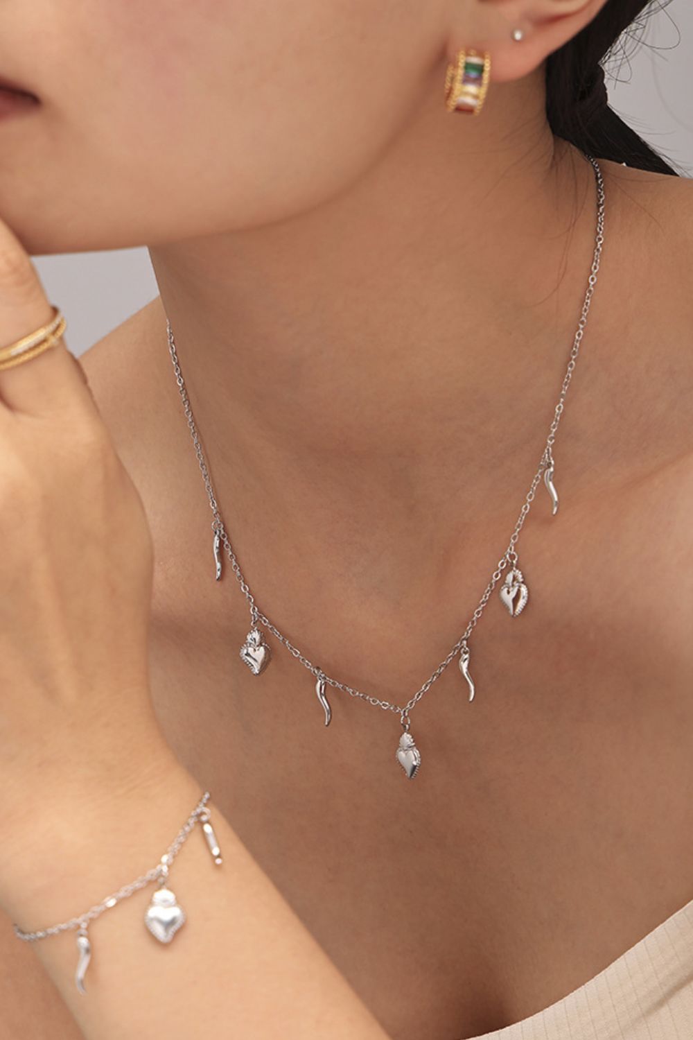 Stainless Steel Heart Charm Bracelet and Necklace Set SETEPENRA .